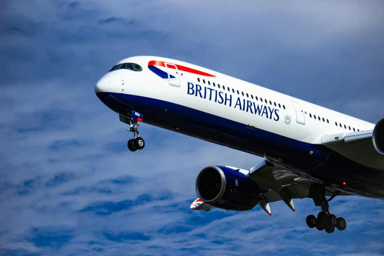 a british airways airplane is flying through the air