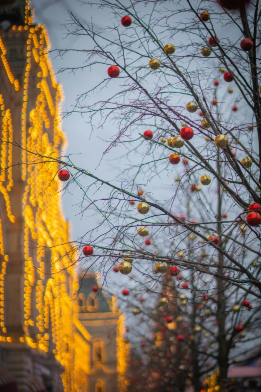 a yellow building and red ornaments are shown