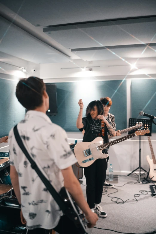 a group of young men playing instruments in a room