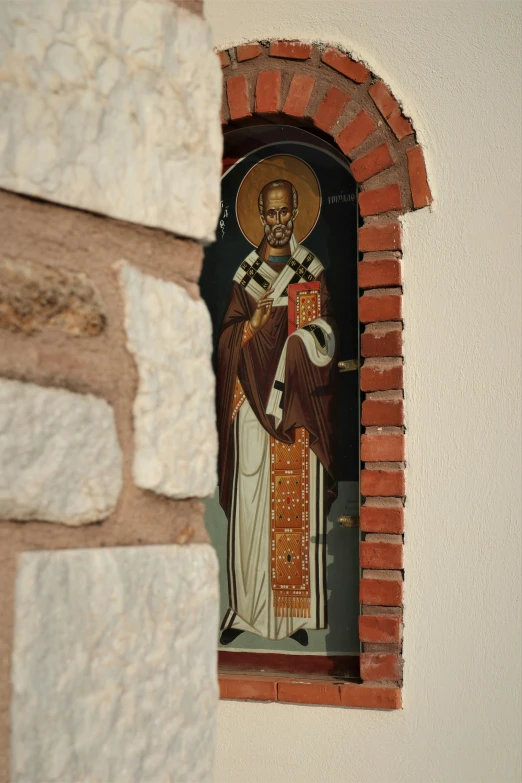 a picture of a man wearing a crown with a cross on his shoulder