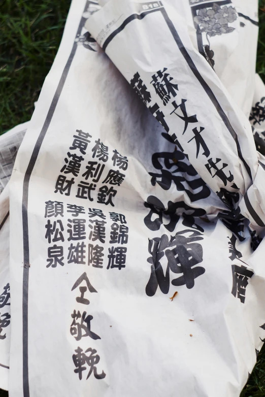 white and black paper wrapped around an oriental paper