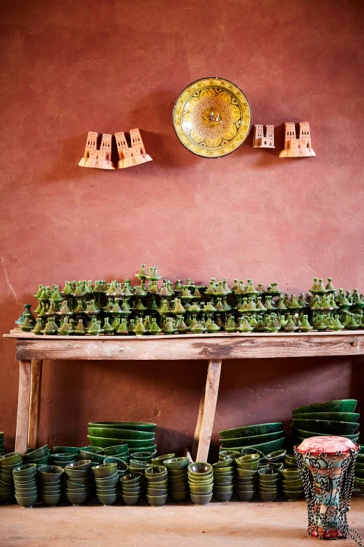 a table that has several plant pots on it