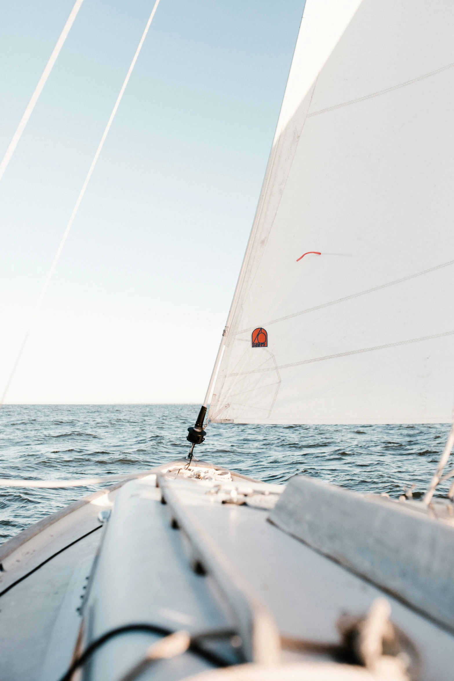 sailboat sailing in open water on sunny day