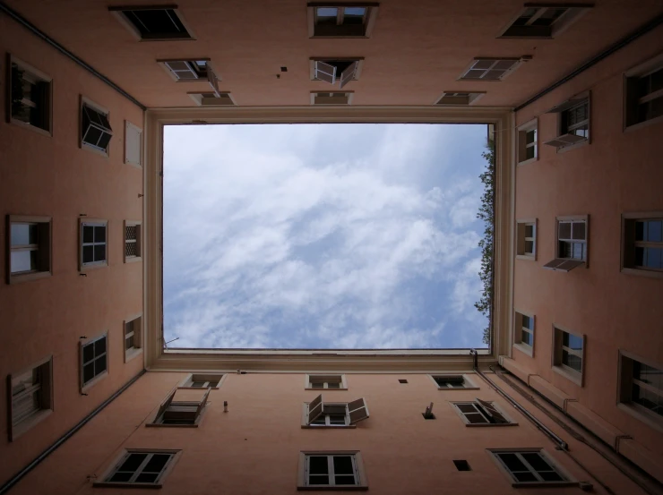 a tall window into a sky that looks upward