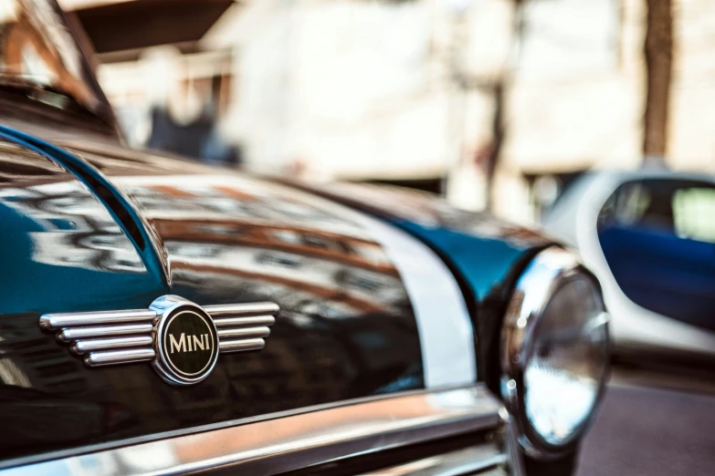 the emblem of an old car that is parked