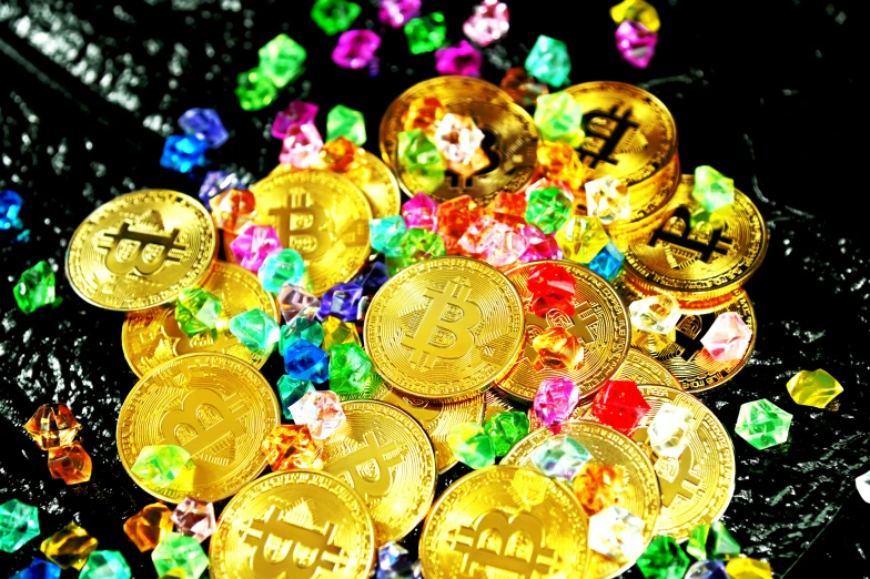 there are many golden bitcoins on top of the plastic