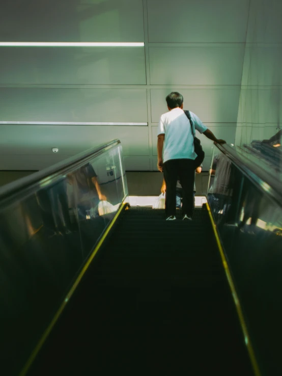 a man standing at the top of a stair case