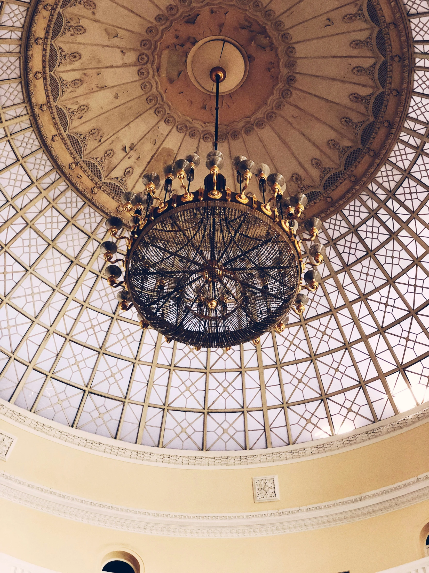 a fancy chandelier in the center of a ceiling