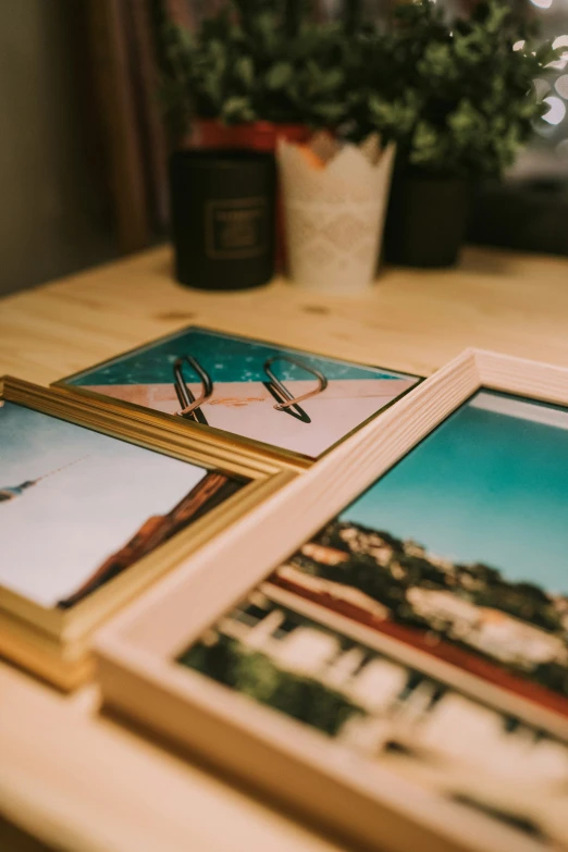 three pos of people hanging on a wooden table