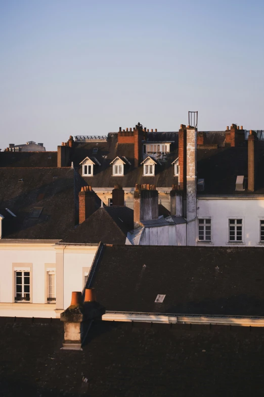 the view of rooftops of many buildings in the morning