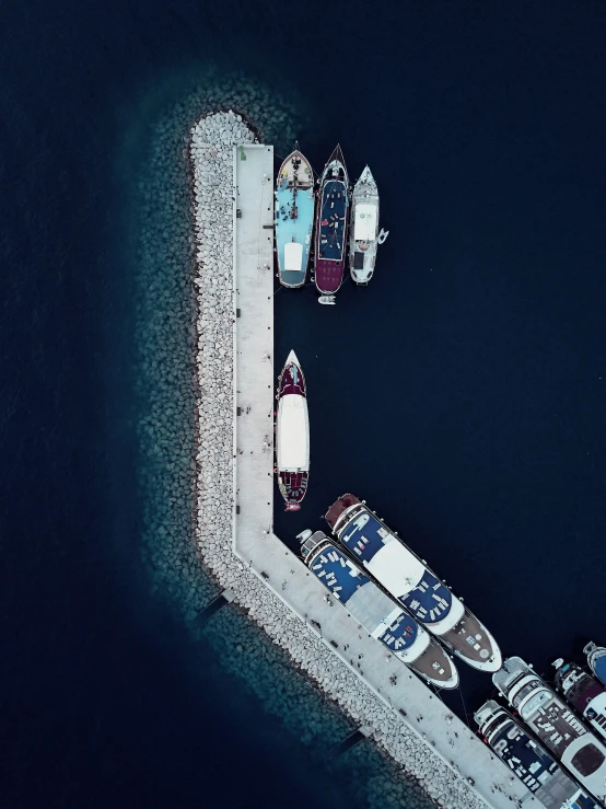 two boats in the water near a pier