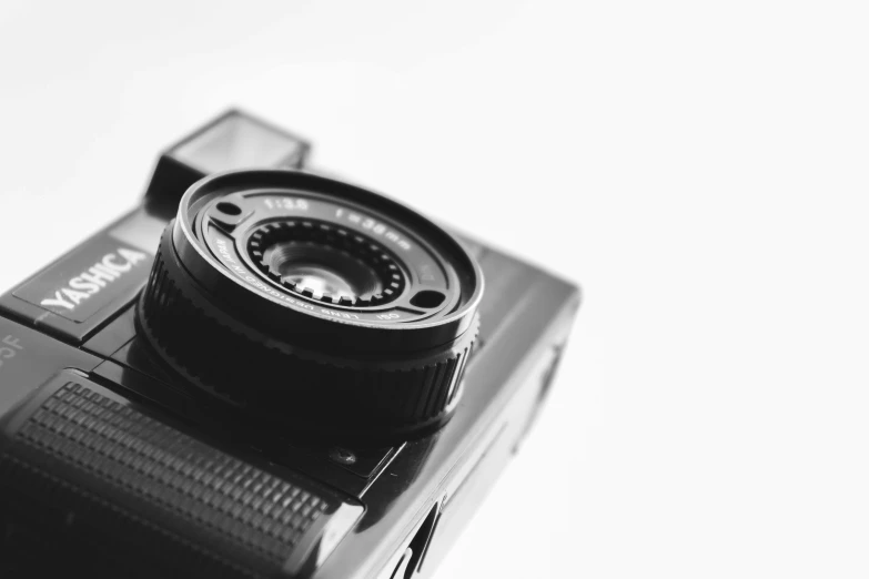 a camera on top of a tripod with an extra lens