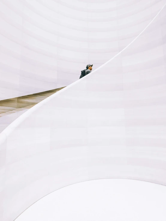 an aerial view of a man snow boarding