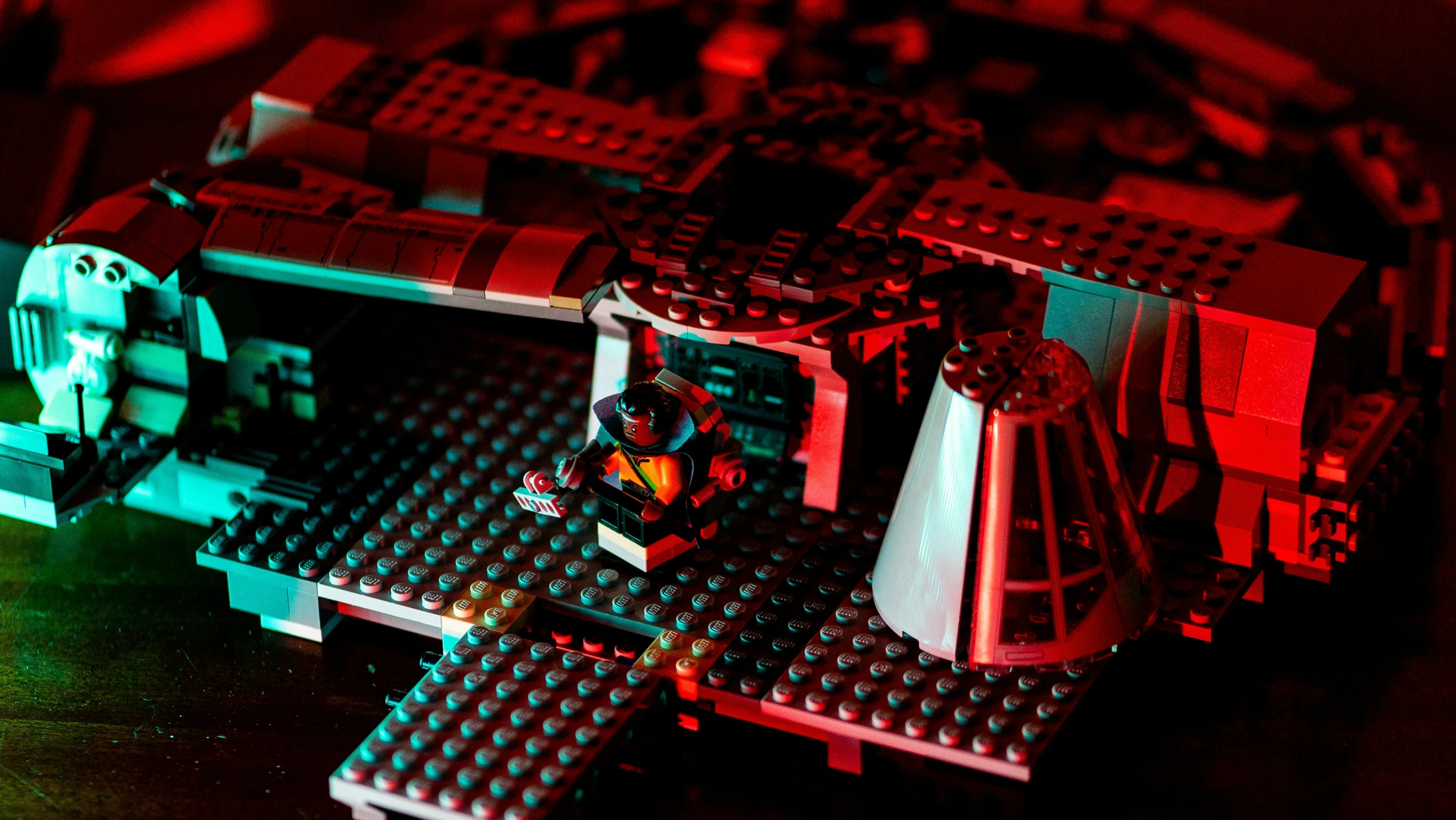 a lego toy has red lights coming from it