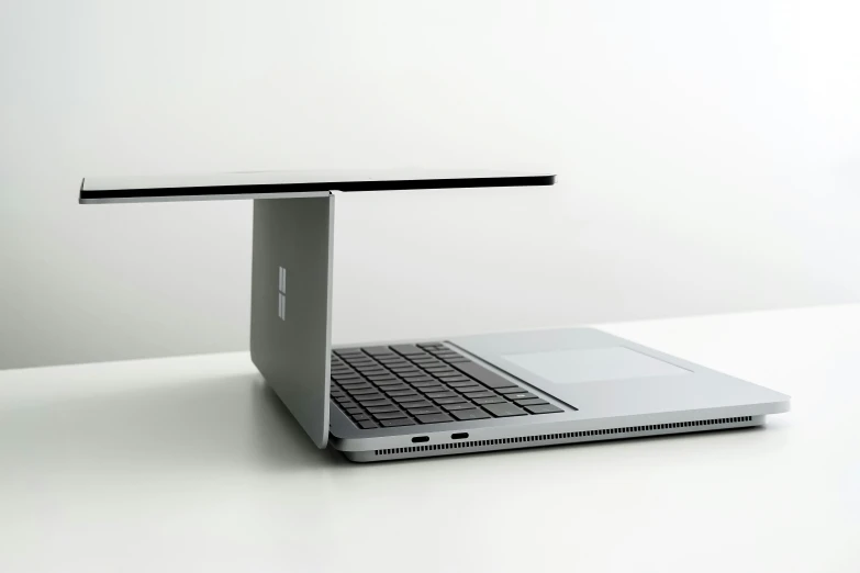 a mac book holder is placed on the laptop