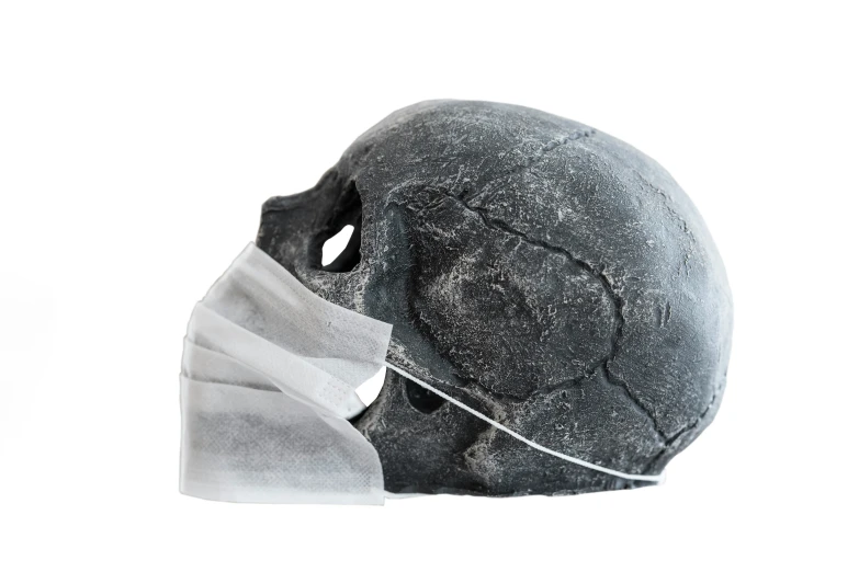 a skull with the visor removed and it's head inside