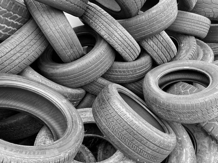 many pieces of tires piled up to make a pile
