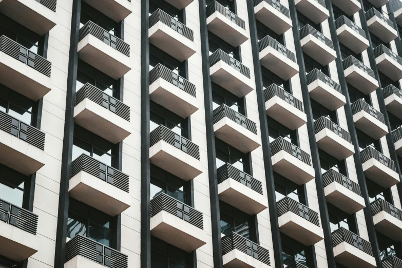 many balconies are hanging on the side of a building