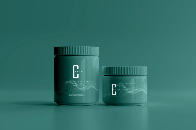 two jars with black caps are standing side by side