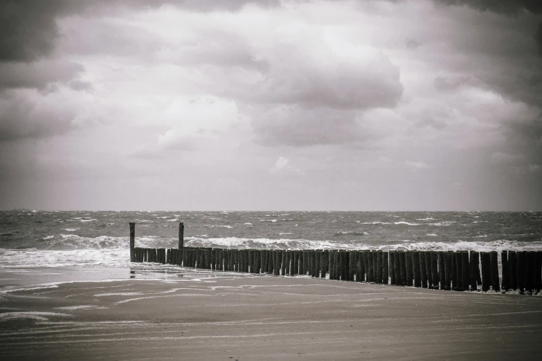 a boat out on the beach near a pier