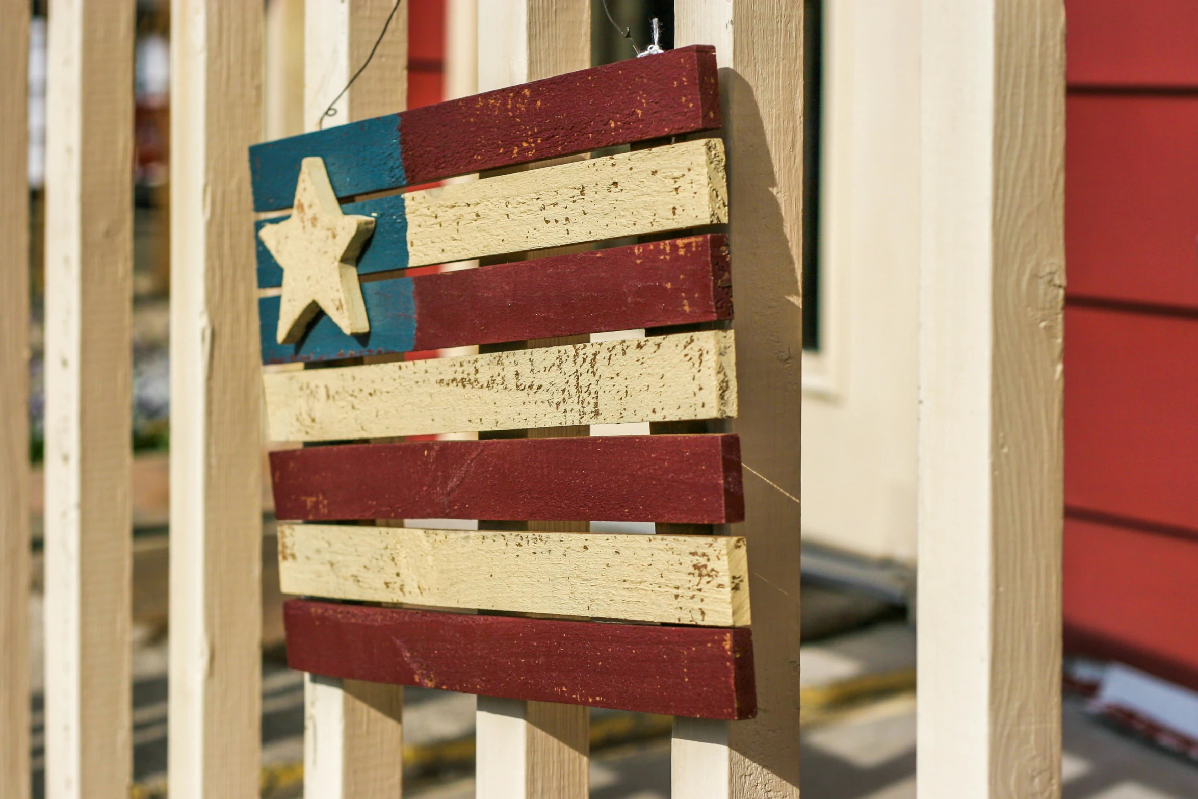 a patriotic sign made out of red white and blue strips