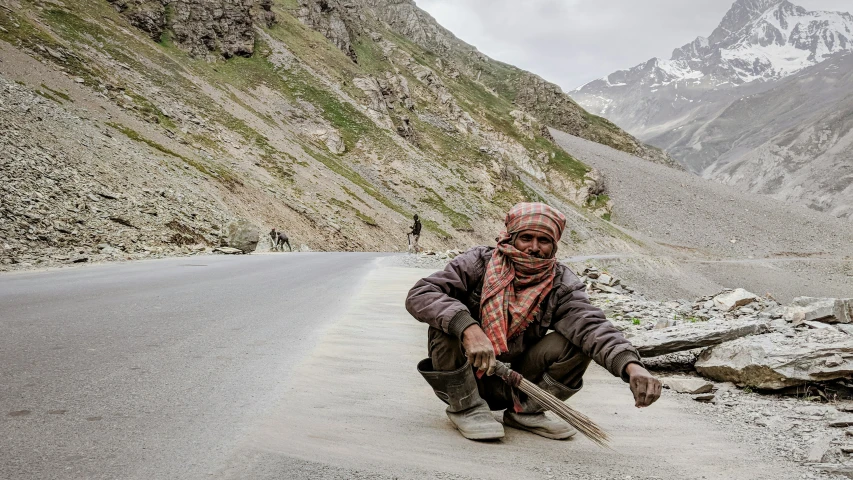 a woman is kneeling down while working on soing