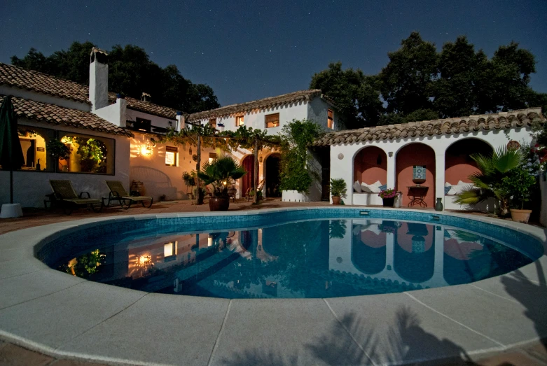 the swimming pool has been decorated with lights