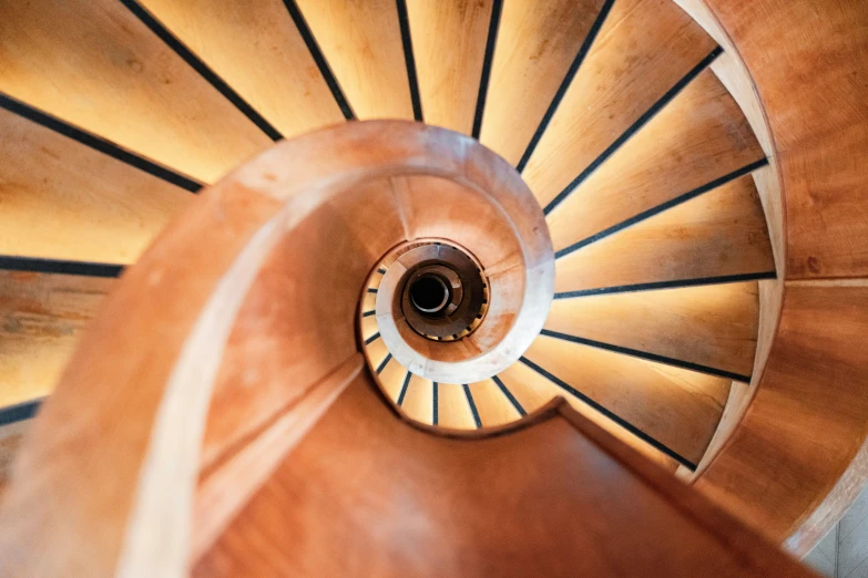 a view from the top of a staircase of spiral stairs