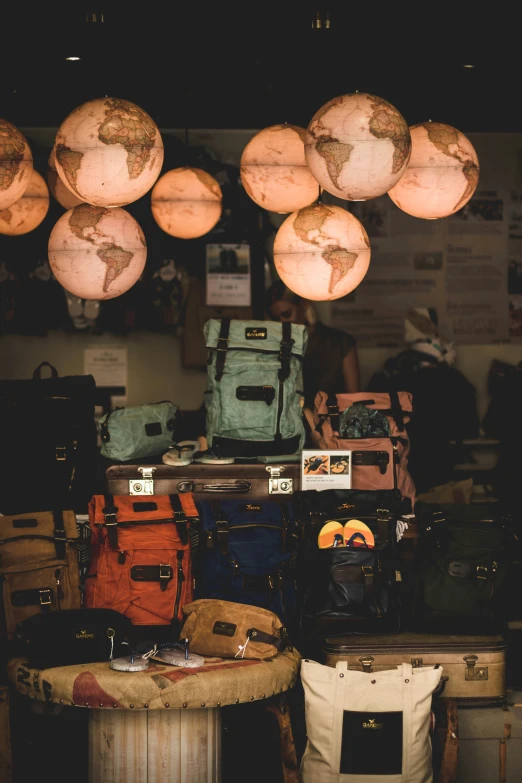 different types and colors of bags are stacked on top of each other