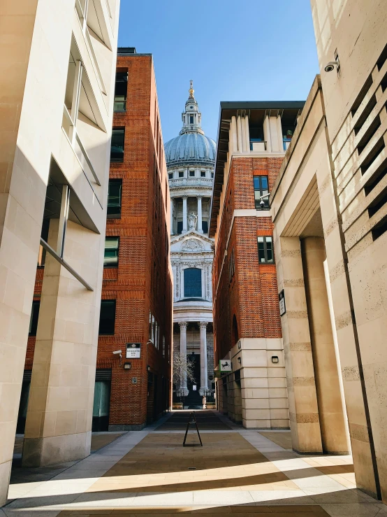 a building is standing between two different buildings