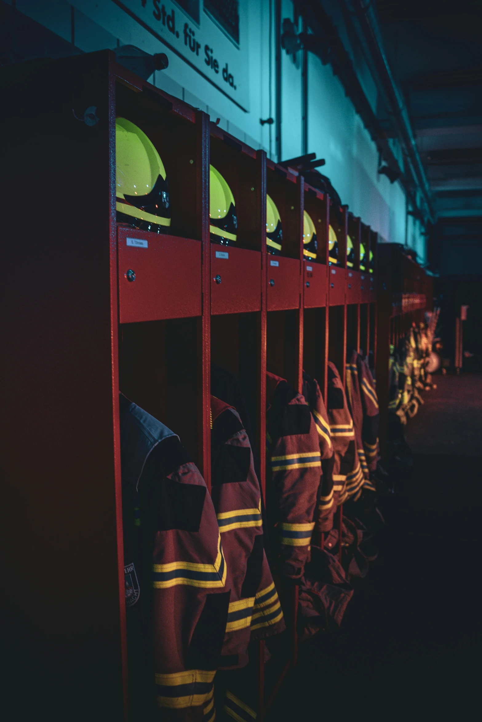 fire fighters sitting at a line with their gear on