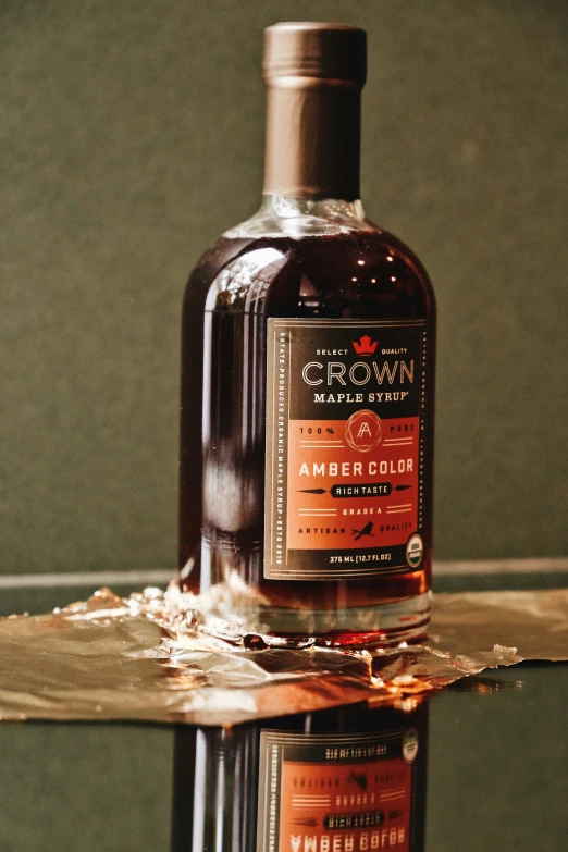 a bottle of liquor sitting on top of a glass table