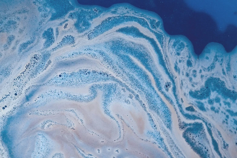 the water is covered with bubbles and blue