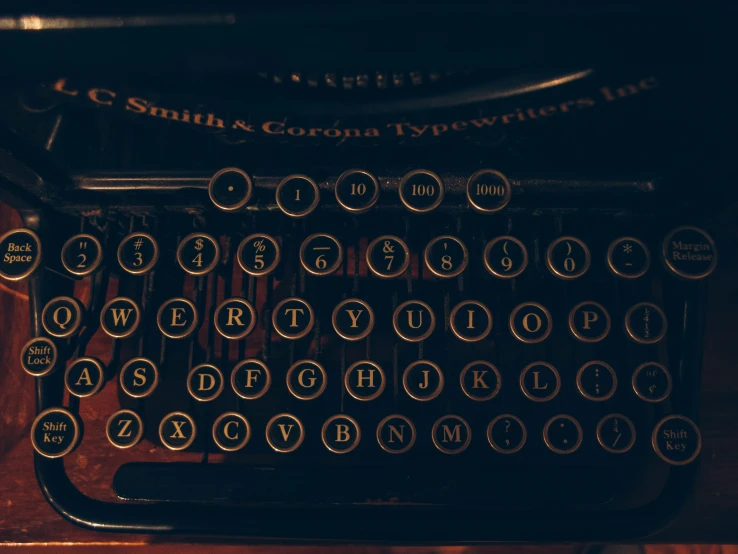 an antique typewriter with words written on it