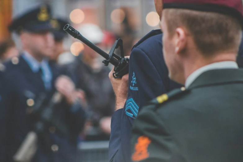 two security officers are on a crowded city street