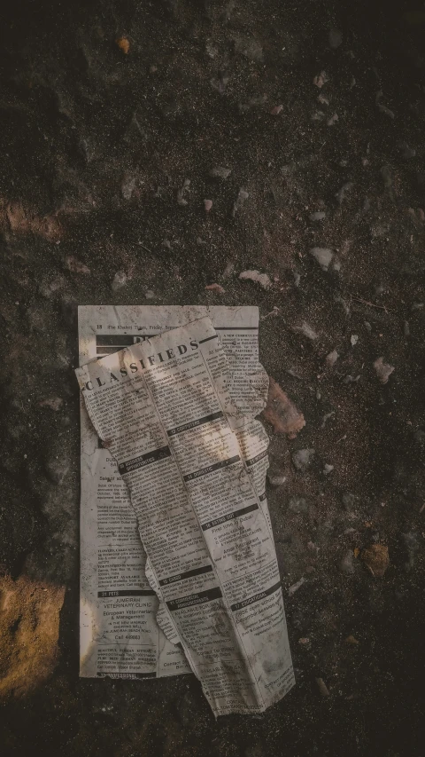 an old newspaper lying on the ground