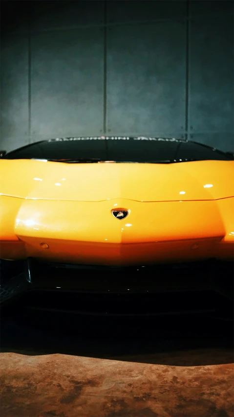 the body of a yellow sports car, in dark room