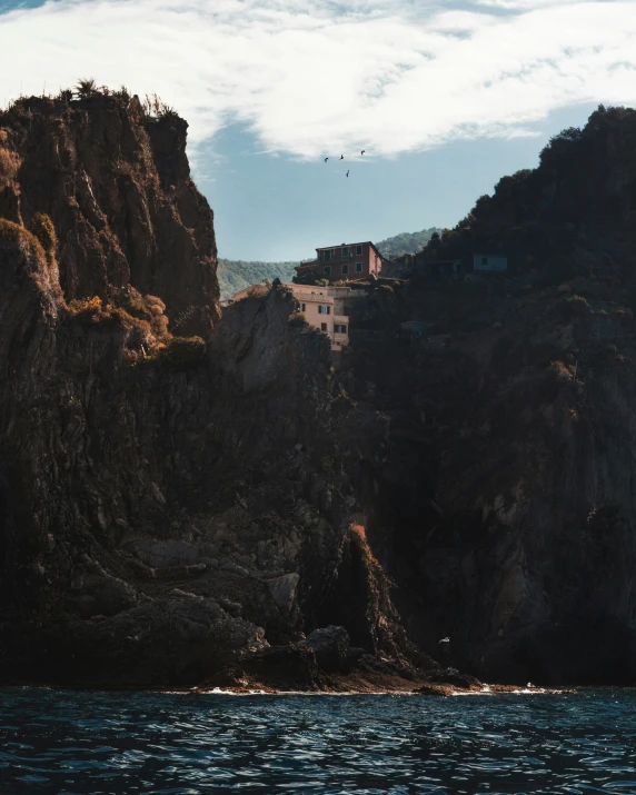 this is an image of a house perched on a cliff