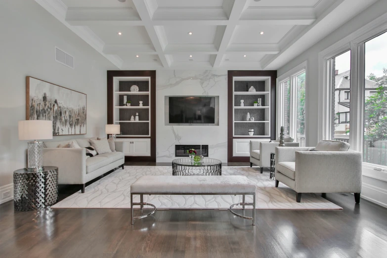 a room is decorated with many windows and wooden floors