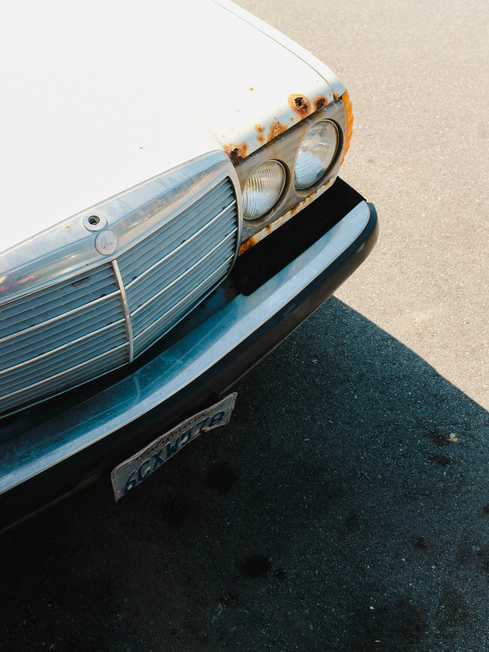 an old - fashioned car is parked with its hood raised up