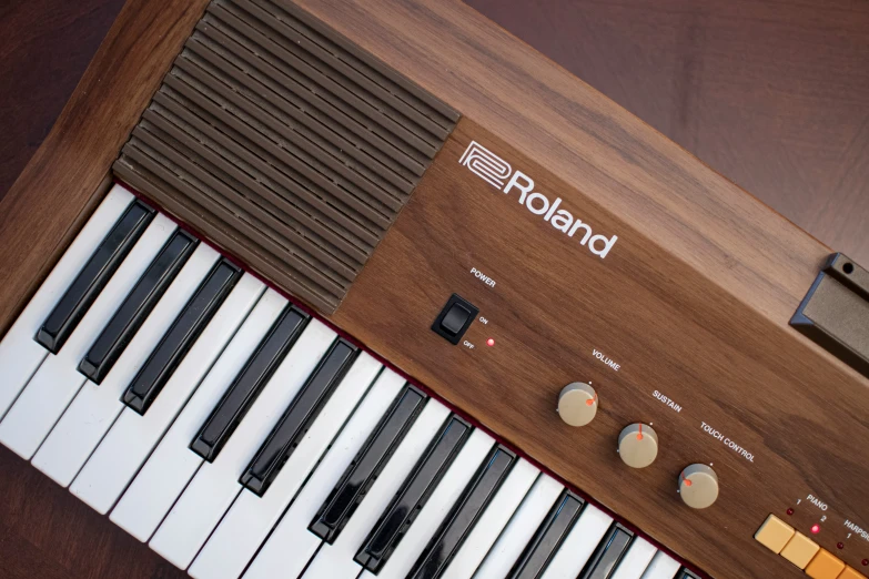 the keyboard of an organ with a tune clock on it