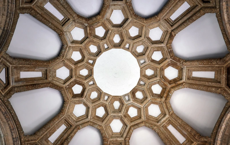 the large round pattern on the ceiling in an ornate building