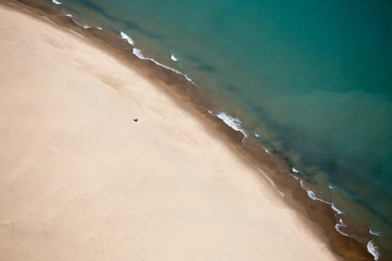 a beach with a long white and blue line