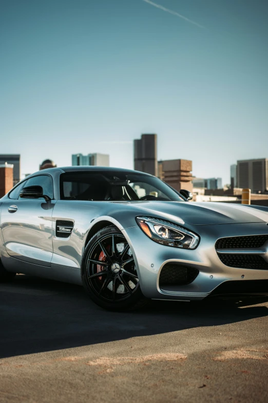 a sports car parked near a parking lot in a city