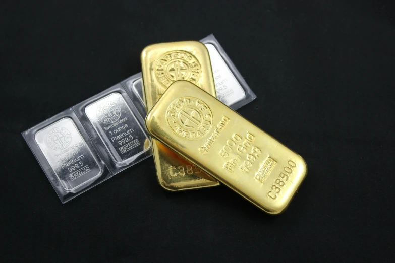 three gold bars are sitting in a container