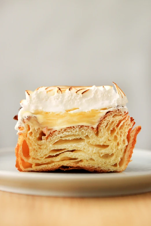 a pastry with a cream filling on a plate