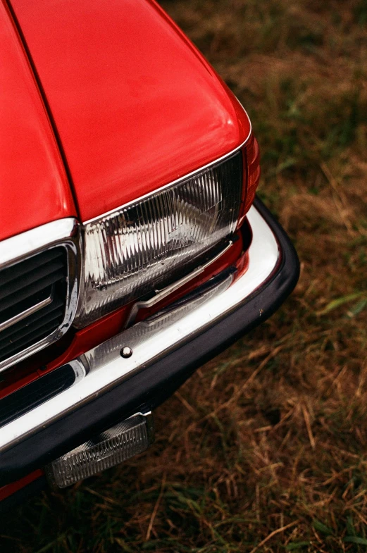 a close up of the front end of a classic car