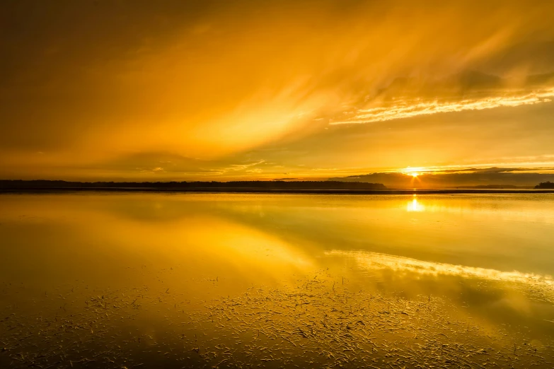 a sunset and the sun reflecting off water