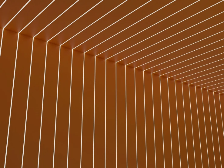 the inside of an orange wall with lines on it