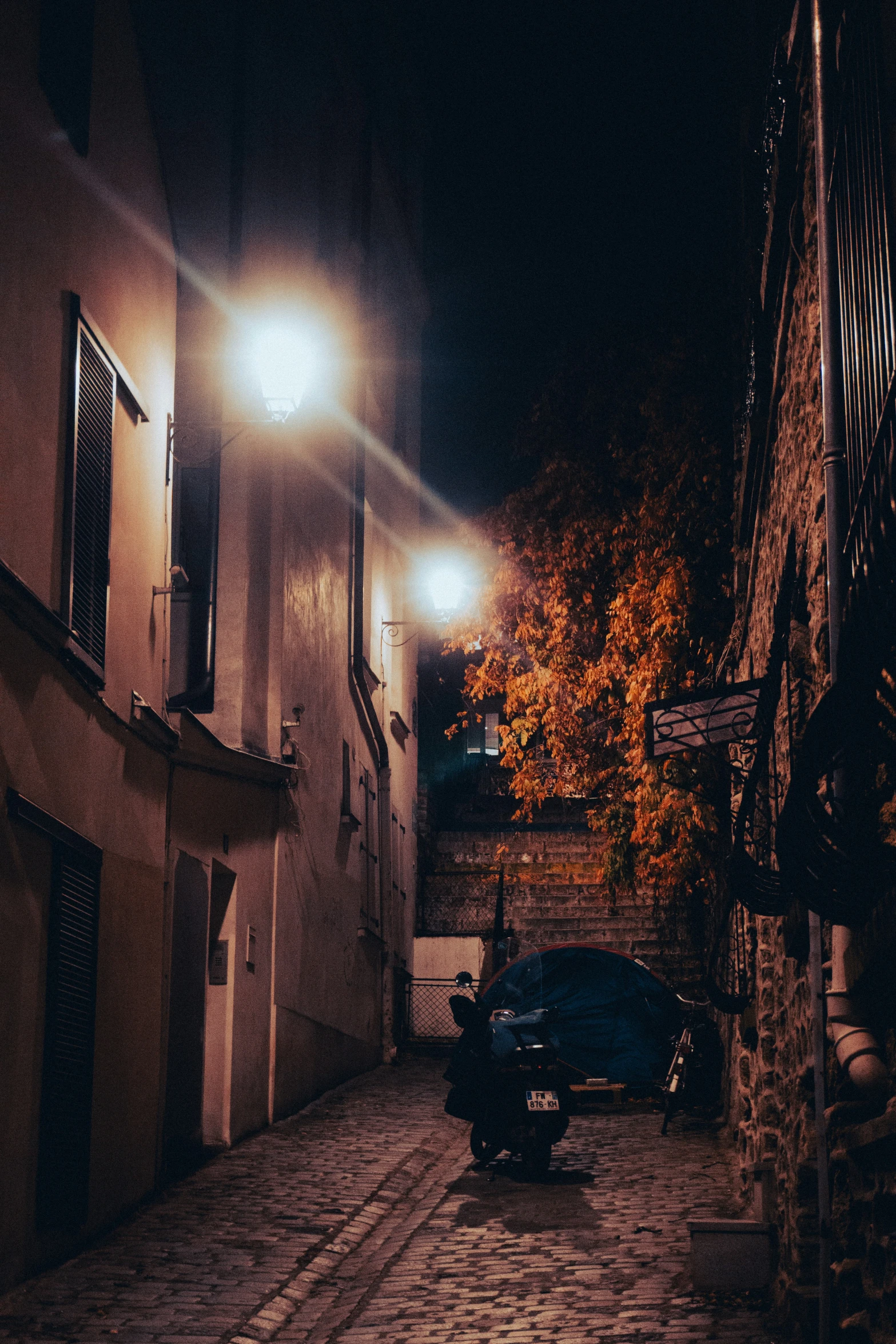 the back alley of an old house in the dark